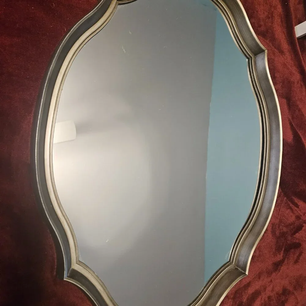 beautiful, scalloped mirror with wire hanger on back